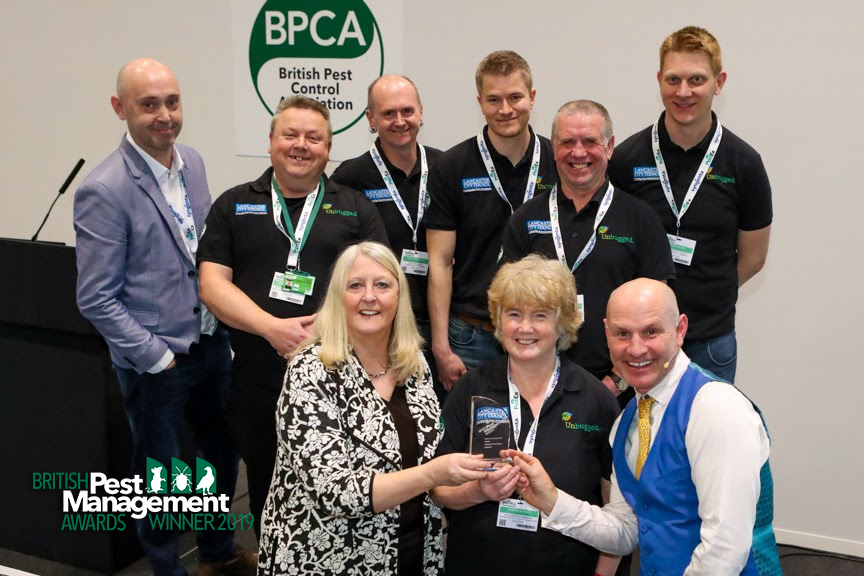 Unbugged win British Pest Management Awards The Lancaster City Council Unbugged team with a member of the BPMA’s judging panel and event host, TV wildlife presenter Mike Dilger.